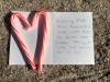 A note for President George H. W. Bush is seen at a makeshift memorial across from Walker's Point, the Bush's summer home, Saturday, Dec. 1, 2018, in Kennebunkport, Maine. Bush died at the age of 94 on Friday, about eight months after the death of his wife, Barbara Bush.