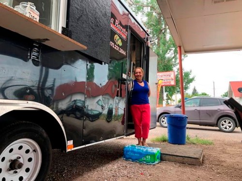 In this Aug. 1, 2019 photo Nena Hermosillo stands outside her taco truck in Cheyenne, Wyo. Cheyenne-based Taco John's, which has nearly 400 locations in 23 states, recently sent Freedom's Edge Brewing Co. in Cheyenne a cease-and-desist letter for using 