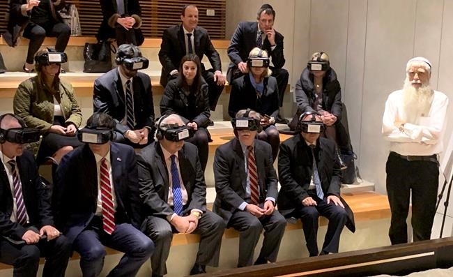 U.S. National Security Adviser John Bolton, seated front row forth from left, participates in a virtual reality demonstration at the Western Wall on Sunday, Jan. 6, 2019, in Jerusalem. U.S. Ambassador to Israel David Friedman and Israeli Ambassador to the U.S. Ron Dermer are sitting alongside. (AP Photo/Zeke Miller)