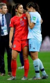 United States' Alex Morgan, left, comforts Thailand's Miranda Nild, right, after the Women's World Cup Group F soccer match between United States and Thailand at the Stade Auguste-Delaune in Reims, France, Tuesday, June 11, 2019. Morgan scored five goals during the match. (AP Photo/Alessandra Tarantino)