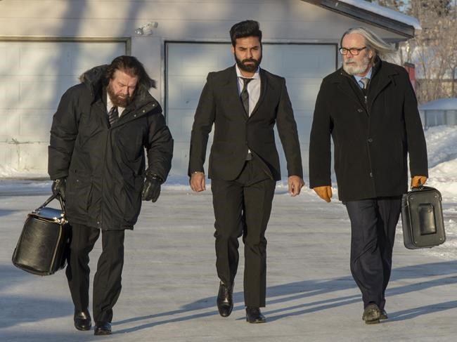 Jaskirat Singh Sidhu, centre, the driver of the truck that struck the bus carrying the Humboldt Broncos hockey team, arrives with his lawyers Mark Brayford, left, and Glen Luther, right, for the third day of his sentencing hearing, Wednesday, January 30, 2019 in Melfort, Sask.THE CANADIAN PRESS/Ryan Remiorz