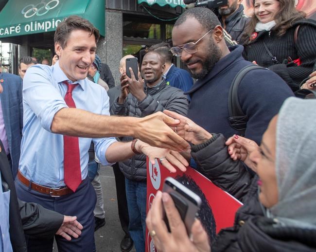 Liberal leader Justin Trudeau greets supporters while campaigning Thursday, October 3, 2019 in Montreal, Quebec. THE CANADIAN PRESS/Ryan Remiorz