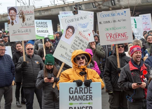 Farmers protest the ongoing CN Rail strike in front of the riding office of Prime Minister Justin Trudeau Monday, November 25, 2019 in Montreal.THE CANADIAN PRESS/Ryan Remiorz