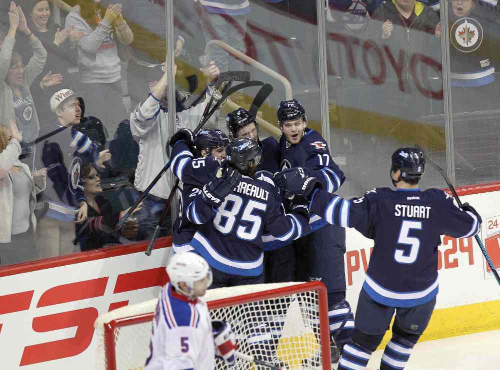 Phil Hossack / Winnipeg Free Press
Winnipeg Jets celebrate an early second-period goal by Lee Stempniak Tuesday.