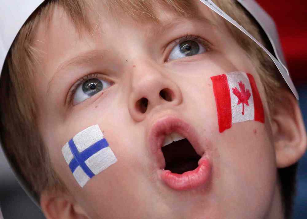 CP
A Russian boy shouts during the Hockey World Championships Group B match between Finland and Canada in St.Petersburg, Russia, Tuesday, May 17, 2016. (AP Photo/Dmitri Lovetsky)