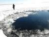 AP
A circular hole in the ice of Chebarkul Lake where a meteor reportedly struck the lake near Chelyabinsk, about 1,500 kilometers (930 miles) east of Moscow, Russia.