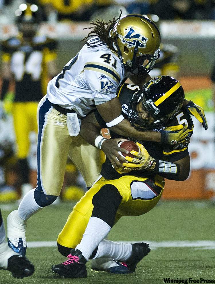 Nathan Denette / The Canadian Press
Hamilton Tiger-Cats quarterback Kevin Glenn, right, gets sacked by Winnipeg Blue Bombers linebacker Clint Kent during CFL action in Hamilton on Friday. The Bombers won 33-17.