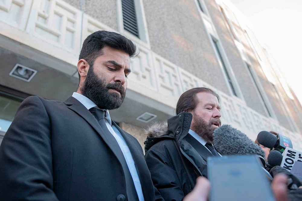 Jaskirat Singh Sidhu leaves provincial court with his lawyer Mark Brayford (right) in Melfort, Sask., Tuesday, January, 8, 2019. Sidhu, the driver of a transport truck involved in a deadly crash with the Humboldt Broncos junior hockey team's bus, has pleaded guilty to all charges against him. THE CANADIAN PRESS/Kayle Neis
