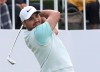 Jason Day of Australia watches his shot on the first hole during the first round of the CJ Cup PGA golf tournament at Nine Bridges on Jeju Island, South Korea, Thursday, Oct. 17, 2019.(Park Ji-ho/Yonhap via AP)