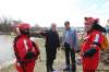 Tim Smith / Brandon Sun
Manitoba Premier Greg Selinger and Brandon East MLA Drew Caldwell chat with Brandon Fire and Emergency Services members Trevor Falk and Sheldon Reynolds as they tour flooded areas along the Assiniboine River in Brandon along 18th Street on Sunday afternoon.
