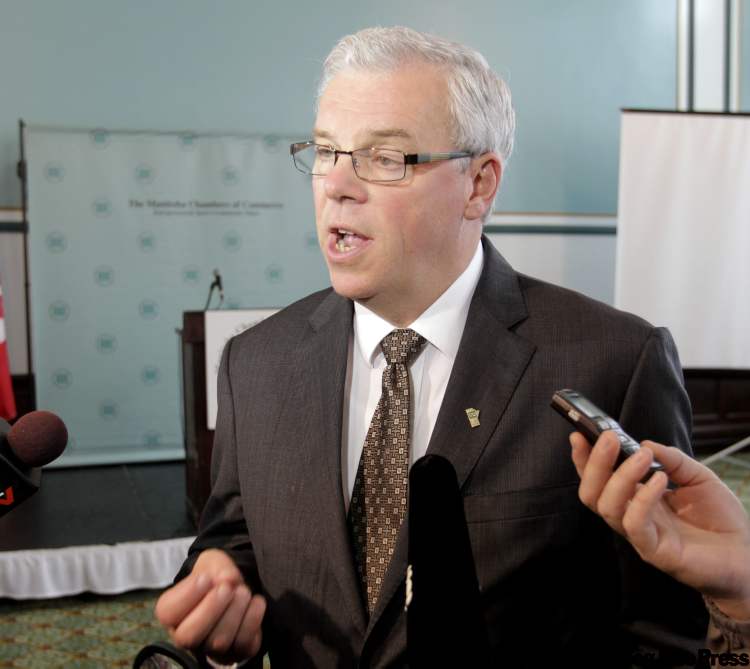 Wayne Glowacki / Winnipeg Free Press
Premier Greg Selinger speaks to reporters Thursday morning after his speech on the future of Manitoba Hydro at the Manitoba Chambers of Commerce Leaders Vision Series held at the Marlborough Hotel.