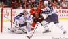 Jean Levac / Postmedia Ottawa Citizen
Jesse Winchester (M) of the Ottawa Senators is pushed by Derek Meech (R) as Ondrej Pavelec (L) of the Winnipeg Jets looks on during first period NHL action in Ottawa Thursday.