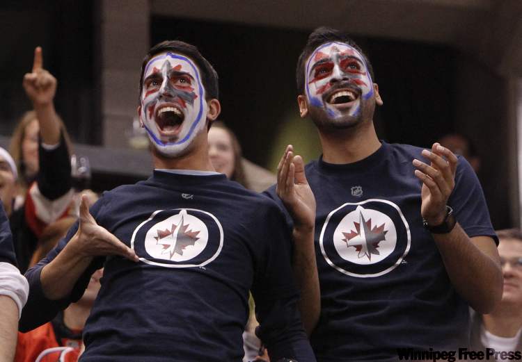 Jean Levac / Postmedia
Fans of the Winnipeg Jets have fun during first period NHL action in Ottawa Thursday.