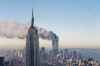 In this Sept. 11, 2001 file photo the twin towers of the World Trade Center burn behind the Empire State Building in New York after terrorists crashed two planes into the towers causing both to collapse.(AP Photo/Marty Lederhandler)