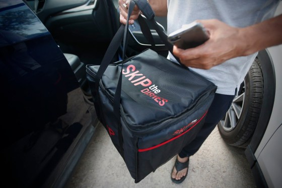JOHN WOODS / WINNIPEG FREE PRESSA driver from SkipTheDishes, the food delivery service, picks up some food at local Winnipeg restaurant Monday.