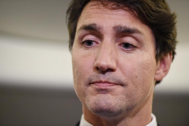 Liberal Leader Justin Trudeau reacts as he makes a statement in regards to photo coming to light of himself from 2001 wearing