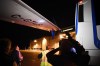 Members of the media inspect the wing from Liberal Leader Justin Trudeau's campaign plane after being struck by the media bus following landing in Victoria, B.C., on Wednesday, Sept.11, 2019. THE CANADIAN PRESS/Sean Kilpatrick