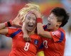 Korea Republic's Cho Sohyun (8) celebrates her goal with teammate Kwon Hahnul during second half FIFA Women's World Cup soccer action against Spain in Ottawa on Wednesday, June 17, 2015. THE CANADIAN PRESS/Sean Kilpatrick