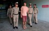 Bahraini Hakeem al-Araibi, center, leaves the criminal court in Bangkok, Thailand, Bangkok, Thailand, Monday, Feb. 4, 2019. The soccer player who has refugee status in Australia told a Thai court Monday that he refuses to be voluntarily extradited to Bahrain, which has asked for his return to serve a prison sentence for a crime he denies committing.(AP Photo/Sakchai Lalit)