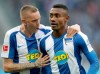 Berlin's scorer Salomon Kalou, right, and his teammate Marius Wolf, left, celebrate their side's second goal during the German Bundesliga soccer match between Hertha BSC Berlin and TSG 1899 Hoffenheim in Berlin, Germany, Saturday, Oct. 26, 2019. (AP Photo/Michael Sohn)