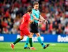 Referee Felix Brych, right, points towards the penalty spot during the UEFA Nations League semifinal soccer match between Portugal and Switzerland at the Dragao stadium in Porto, Portugal, Wednesday, June 5, 2019. (AP Photo/Martin Meissner)