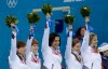 Robert F. Bukaty / The Associated Press
Canada's gold medal winning curling team, from left, Kirsten Wall, Dawn McEwen, Jill Officer, Kaitlyn Lawes, and skip Jennifer Jones raise their arms during the flower ceremony today after defeating Sweden in women's curling at the 2014 Winter Olympics in Sochi, Russia.
