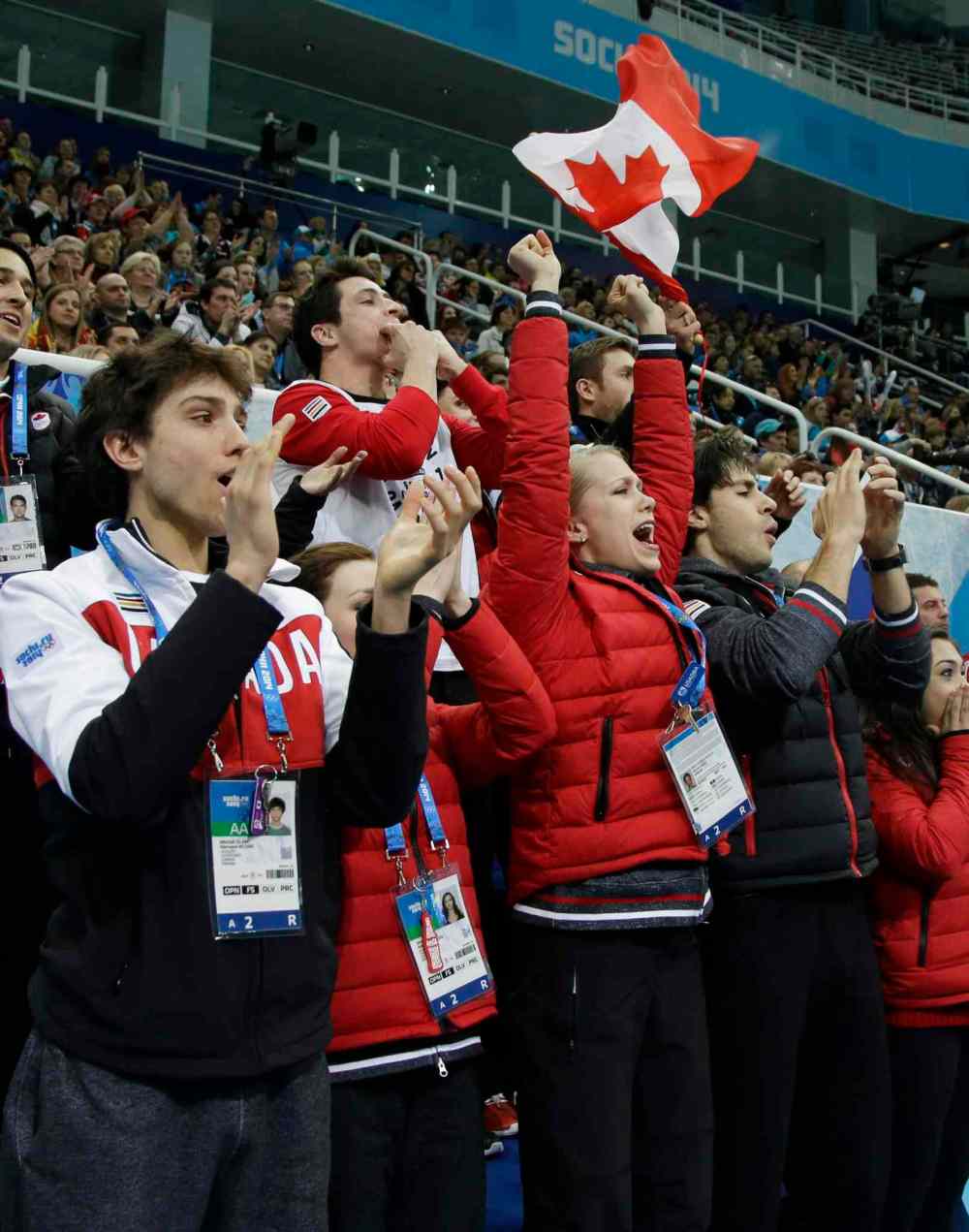 Darron Cummings / The Associated Press
The Canadian team cheer for Meagan Duhamel and Eric Radford of Canada during the team pairs short program figure skating competition at the Iceberg Skating Palace during the 2014 Winter Olympics, Thursday, Feb. 6, 2014, in Sochi, Russia.