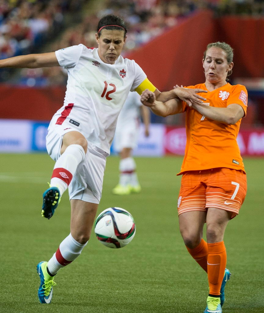 Paul Chiasson / THE CANADIAN PRESS
Canada forward Christine Sinclair kicks the ball away from Netherlands forward Mano Melis during second half Women's World Cup soccer action in Montreal.