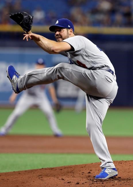 Los Angeles Dodgers starting pitcher Rich Hill follows through on a delivery to a Tampa Bay Rays batter during the first inning of a baseball game Wednesday, May 22, 2019, in St. Petersburg, Fla. (AP Photo/Chris O'Meara)