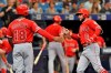 Los Angeles Angels' Brian Goodwin (18) celebrates with David Fletcher (6) after Fletcher's two-run home run off Tampa Bay Rays starter Charlie Morton during the second inning of a baseball game Saturday, June 15, 2019, in St. Petersburg, Fla. (AP Photo/Steve Nesius)