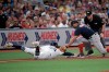 Tampa Bay Rays' Avisail Garcia (24) safely dives under the tag of Boston Red Sox shortstop Xander Bogaerts (2) after Joey Wendle flied out to left field during the third inning of a baseball game Friday, Sept. 20, 2019, in St. Petersburg, Fla. (AP Photo/Phelan M. Ebenhack)