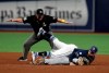 Tampa Bay Rays shortstop Willy Adames lands on top of Toronto Blue Jays' Jonathan Davis, bottom, after Davis stole second base during the sixth inning of a baseball game Saturday, Sept. 7, 2019, in St. Petersburg, Fla. Doug Eddings, top, makes the call. (AP Photo/Chris O'Meara)