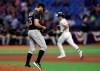 Colorado Rockies starting pitcher Chad Bettis walks back to the mound as Tampa Bay Rays' Brandon Lowe runs around the bases after his home run during the fourth inning of a baseball game Monday, April 1, 2019, in St. Petersburg, Fla. (AP Photo/Chris O'Meara)