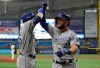 Kansas City Royals' Alex Gordon (4) celebrates his home run off Tampa Bay Rays pitcher Yonny Chirinos with Ryan O'Hearn during the first inning of a baseball game Monday, April 22, 2019, in St. Petersburg, Fla. (AP Photo/Chris O'Meara)
