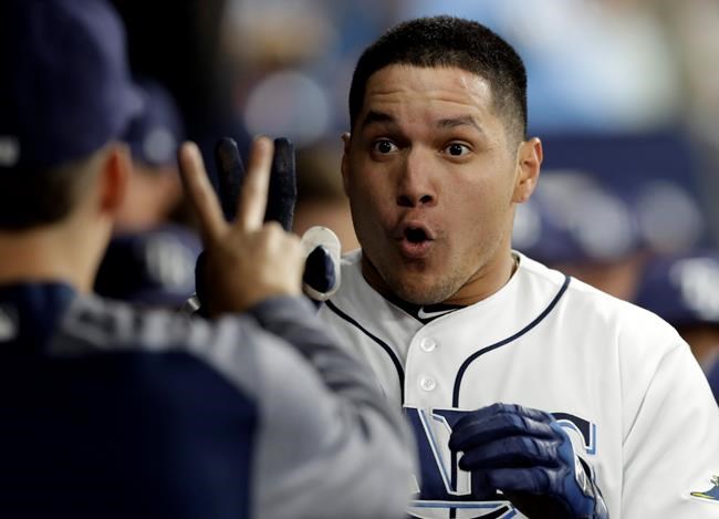 Tampa Bay Rays' Avisail Garcia, right, celebrates with Blake Snell after Garcia hit an inside-the-park home run off Toronto Blue Jays starting pitcher Clayton Richard during the third inning of a baseball game, Tuesday, May 28, 2019, in St. Petersburg, Fla. (AP Photo/Chris O'Meara)