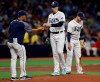 Tampa Bay Rays starting pitcher Blake Snell, center, hands the ball to manager Kevin Cash, left, as he is taken out of the baseball game against the Los Angeles Angels during the fourth inning Friday, June 14, 2019, in St. Petersburg, Fla. Looking away is third baseman Daniel Robertson. (AP Photo/Chris O'Meara)