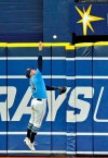 Tampa Bay Rays' Avisail Garcia stretches to reach a RBI-triple off the wall hit by Chicago White Sox's Yolmer Sanchez during the seventh inning of a baseball game Sunday, July 21, 2019, in St. Petersburg, Fla. (AP Photo/Steve Nesius)