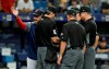Boston Red Sox manager Alex Cora yells as he talks to the umpiring crew during the eighth inning of a baseball game against the Tampa Bay Rays Wednesday, July 24, 2019, in St. Petersburg, Fla. Cora was upset about the Rays moving pitcher Adam Kolarek from pitcher to first base and then back to pitcher during the inning. (AP Photo/Chris O'Meara)