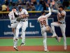 Detroit Tigers shortstop Jordy Mercer (7), center fielder Harold Castro (30), second baseman Niko Goodrum (28) and left fielder Victor Reyes (22) celebrate after getting a win over the Tampa Bay Rays in a baseball game Friday, Aug. 16, 2019, in St. Petersburg, Fla. (AP Photo/Phelan M. Ebenhack)