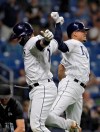 Tampa Bay Rays' Mike Zunino, left, celebrates with Willy Adames after Zunino hit a home run off Kansas City Royals pitcher Tim Hill during the sixth inning of a baseball game Tuesday, April 23, 2019, in St. Petersburg, Fla. (AP Photo/Chris O'Meara)