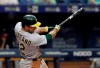 Oakland Athletics' Ramon Laureano connects for a grand slam off Tampa Bay Rays pitcher Colin Poche during the eighth inning of a baseball game Wednesday, June 12, 2019, in St. Petersburg, Fla. (AP Photo/Chris O'Meara)