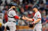 Boston Red Sox catcher Sandy Leon, left, and reliever Marcus Walden, right, shake hands after a 5-4 win over the Tampa Bay Rays during the ninth inning of a baseball game Tuesday, July 23, 2019, in St. Petersburg, Fla. (AP Photo/Steve Nesius)