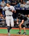 New York Yankees' Aaron Judge, left, steps off home plate after hitting a solo home run off Tampa Bay Rays reliever Ryne Stanek during the 11th inning of a baseball game Friday, July 5, 2019, in St. Petersburg, Fla. (AP Photo/Steve Nesius)