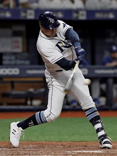 Tampa Bay Rays' Avisail Garcia connects for a three-run home run off Los Angeles Dodgers relief pitcher Dylan Floro during the seventh inning of a baseball game Wednesday, May 22, 2019, in St. Petersburg, Fla. (AP Photo/Chris O'Meara)