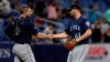 Seattle Mariners relief pitcher Matt Magill (61) shakes hands with catcher Tom Murphy (2) after closing out the Tampa Bay Rays during the ninth inning of a baseball game Tuesday, Aug. 20, 2019, in St. Petersburg, Fla. (AP Photo/Chris O'Meara)