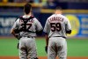 Cleveland Indians pitcher Carlos Carrasco (59) stands with catcher Kevin Plawecki during the playing of 