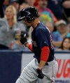 Boston Red Sox's Mookie Betts pumps his fist as he runs around the bases after hitting a home run off Tampa Bay Rays relief pitcher Diego Castillo during the eighth inning of a baseball game Friday, April 19, 2019, in St. Petersburg, Fla. (AP Photo/Chris O'Meara)
