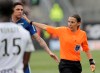 French referee Stephanie Frappart, right, in action during the French League One soccer match between Amiens and Strasbourg, at the Stade de la Licorne stadium in Amiens, France, Sunday, April 28, 2019. Stephanie Frappart is the first woman to referee a Ligue One soccer match in France. (AP Photo/Michel Spingler)