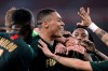 Monaco's players react after scoring during the French League One soccer match between Lille and Monaco at the Lille Metropole stadium, in Villeneuve d'Ascq, northern France, Friday, March 15, 2019. (AP Photo/Michel Spingler)
