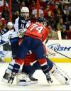 Chuck Myers / MCT
Jets captain Andrew Ladd and Washington Capitals defenceman John Carlson  sandwich Capitals goalie Braden Holtby in the first period Tuesday. Ladd and his linemates carried a disproportionate load in the scoring department. That has to change for the Jets to move forward.
